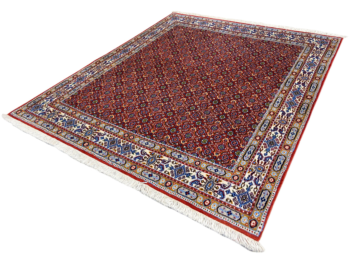 Orientteppich 132x122 cm, rotes Feinmuster mit blau-weißem Zierrahmen und Fransen