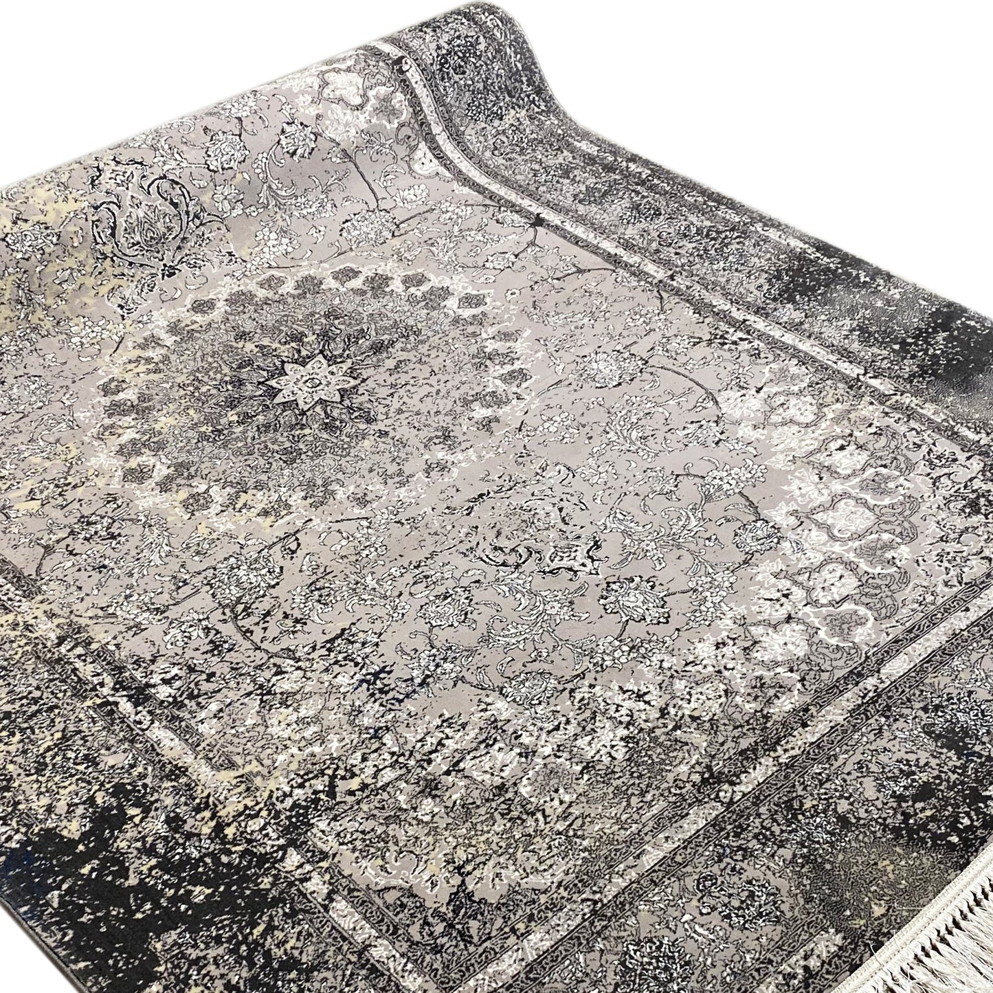 Polypropylen Flächenteppich, aufwendiges Zentral-Medaillon, Grau- und Schwarztöne, eleganter Stil.