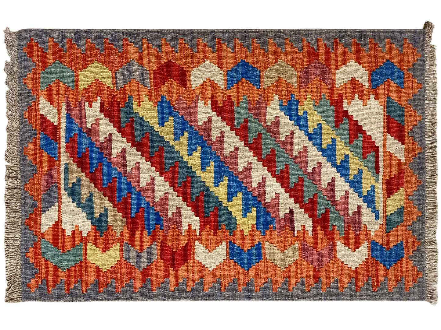 Boho Teppich Kelim Orange mit blauen Akzenten und geometrischen Formen